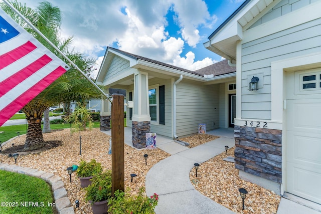 3422 Oglebay Dr, Green Cove Springs, FL 32043 - doorway to property with a shingled roof and a garage