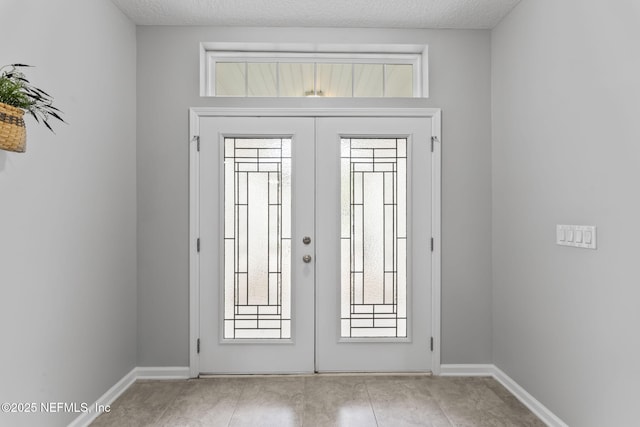 3422 Oglebay Dr, Green Cove Springs, FL 32043 - doorway featuring baseboards, light tile patterned flooring, and french doors
