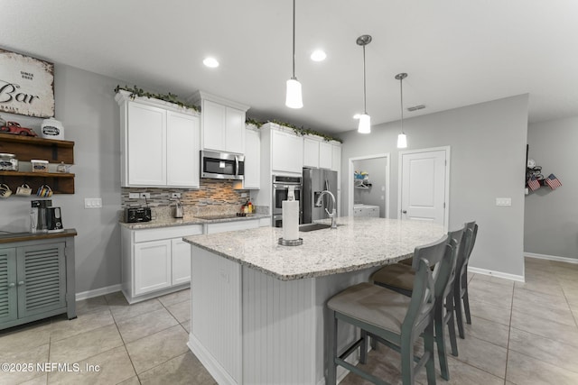 3422 Oglebay Dr, Green Cove Springs, FL 32043 - kitchen with tasteful backsplash, light tile patterned floors, a sink, and stainless steel appliances