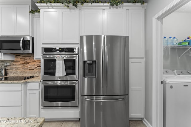 3422 Oglebay Dr, Green Cove Springs, FL 32043 - kitchen featuring light stone countertops, tasteful backsplash, separate washer and dryer, white cabinets, and stainless steel appliances