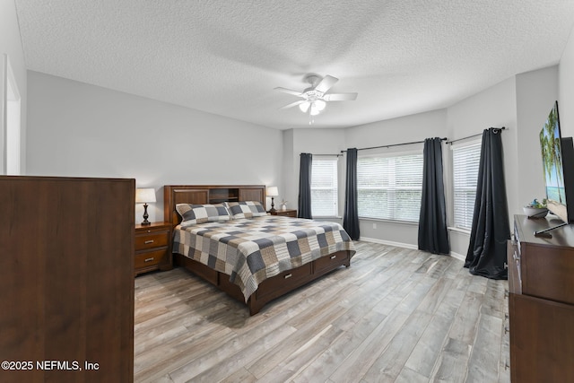 3422 Oglebay Dr, Green Cove Springs, FL 32043 - bedroom with light wood-style flooring, a textured ceiling, and a ceiling fan