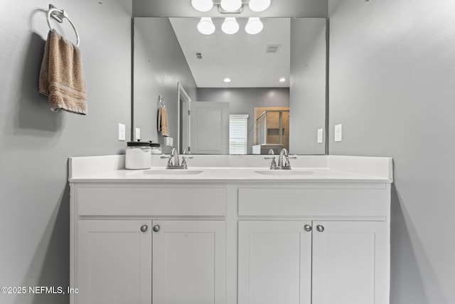 3422 Oglebay Dr, Green Cove Springs, FL 32043 - full bathroom with double vanity, visible vents, a sink, and a stall shower