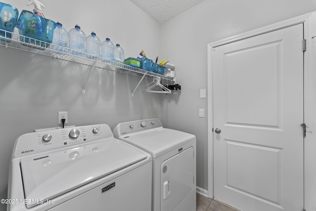 3422 Oglebay Dr, Green Cove Springs, FL 32043 - clothes washing area with laundry area, tile patterned flooring, a textured ceiling, and washer and clothes dryer