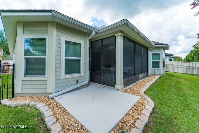3422 Oglebay Dr, Green Cove Springs, FL 32043 - back of house with a yard, fence, a patio, and a sunroom