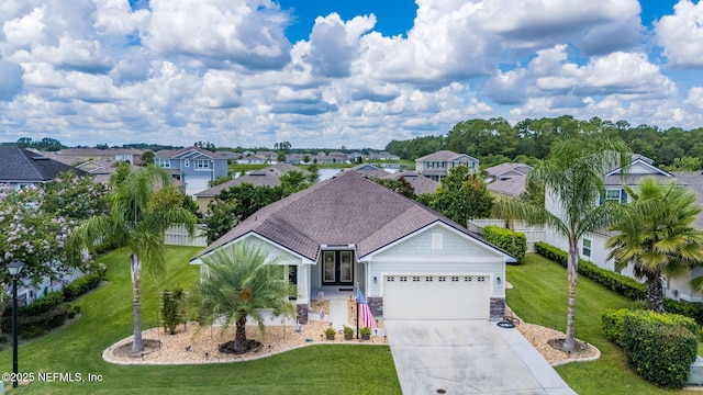 3422 Oglebay Dr, Green Cove Springs, FL 32043 - single story home with concrete driveway, stone siding, a front lawn, a garage, and a residential view