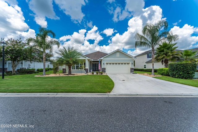 3422 Oglebay Dr, Green Cove Springs, FL 32043 - view of front of property featuring an attached garage, driveway, a front yard, and stone siding