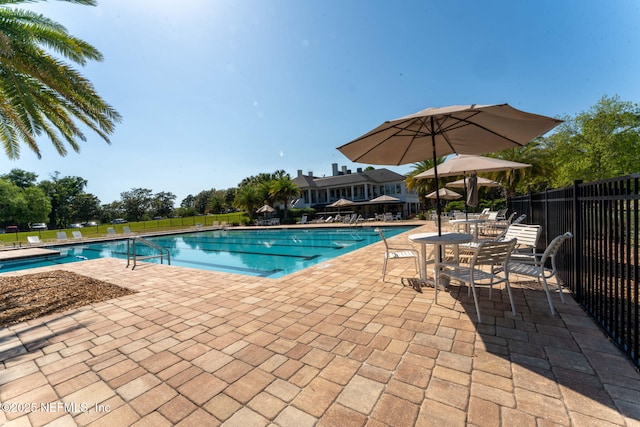 3422 Oglebay Dr, Green Cove Springs, FL 32043 - pool with a patio area and fence