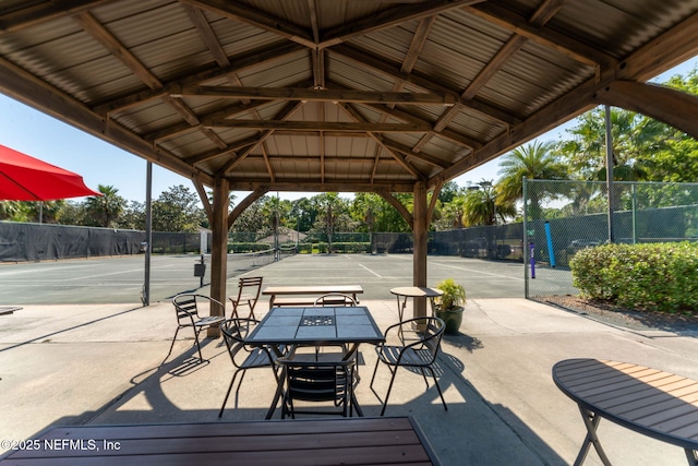 3422 Oglebay Dr, Green Cove Springs, FL 32043 - view of property's community with a tennis court, fence, and outdoor dining space
