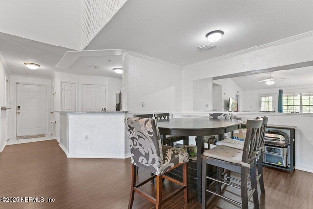 7800 Point Meadows Dr Unit 1035, Jacksonville, FL 32256 - dining area featuring ornamental molding, wood finished floors, a ceiling fan, and baseboards