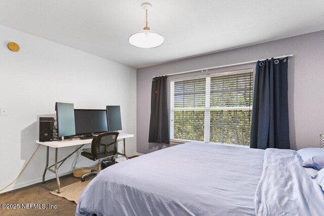 7800 Point Meadows Dr Unit 1035, Jacksonville, FL 32256 - carpeted bedroom featuring baseboards and an office area
