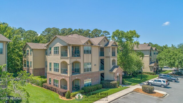 7800 Point Meadows Dr Unit 1035, Jacksonville, FL 32256 - view of property featuring uncovered parking