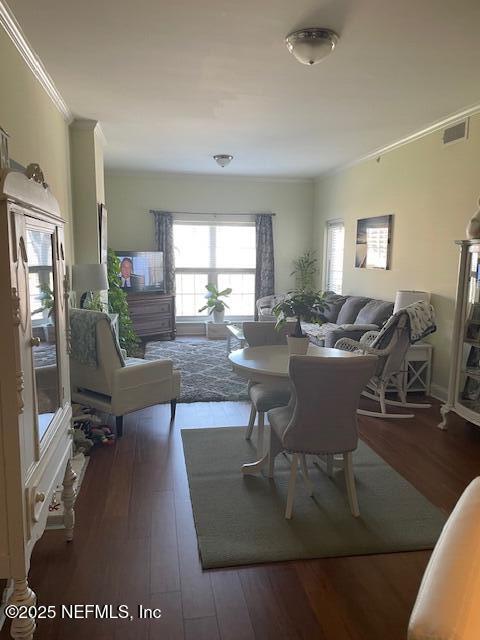 400 E Bay St Unit 502, Jacksonville, FL 32202 - dining space featuring crown molding, wood finished floors, and visible vents