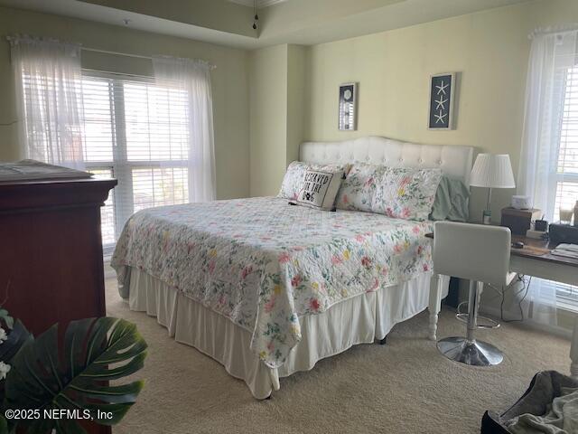 400 E Bay St Unit 502, Jacksonville, FL 32202 - carpeted bedroom featuring ornamental molding