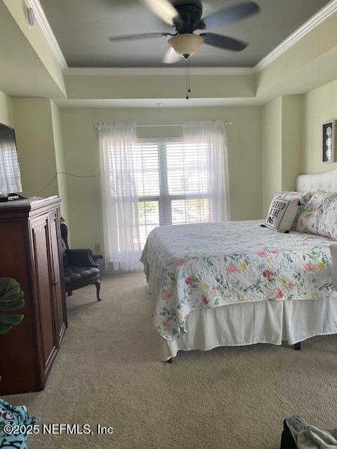 400 E Bay St Unit 502, Jacksonville, FL 32202 - bedroom featuring light colored carpet, crown molding, multiple windows, and a raised ceiling