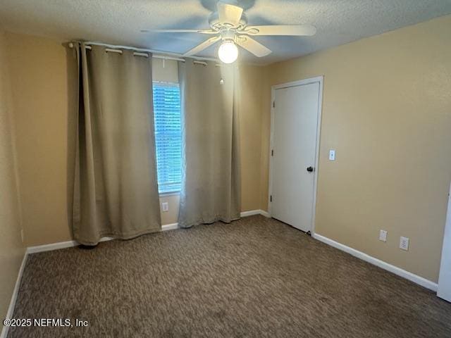 7701 Timberlin Park Blvd Unit 531, Jacksonville, FL 32256 - spare room with a ceiling fan, carpet, baseboards, and a textured ceiling