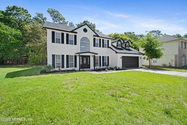 3399 Shauna Oaks Cir, Jacksonville, FL 32277 - colonial home featuring brick siding, a front lawn, driveway, and an attached garage