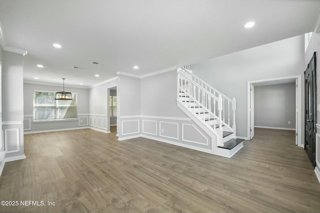 3399 Shauna Oaks Cir, Jacksonville, FL 32277 - unfurnished living room featuring recessed lighting, stairway, visible vents, and ornamental molding