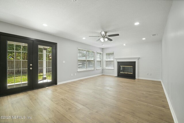 3399 Shauna Oaks Cir, Jacksonville, FL 32277 - unfurnished living room with french doors, baseboards, recessed lighting, wood finished floors, and ceiling fan