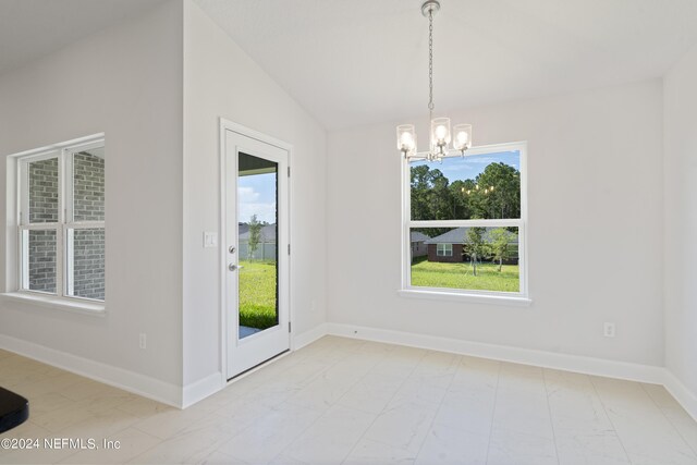3211 Winding Creek Pl, Green Cove Springs, FL 32043 - unfurnished dining area with a chandelier, marble finish floor, baseboards, and lofted ceiling
