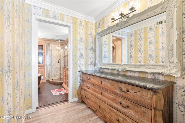 full bathroom featuring vanity, ornamental molding, wood finished floors, and wallpapered walls