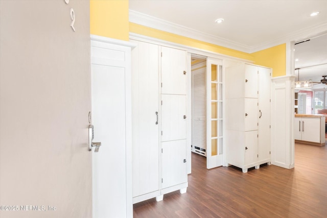 interior space with recessed lighting, ornamental molding, and wood finished floors