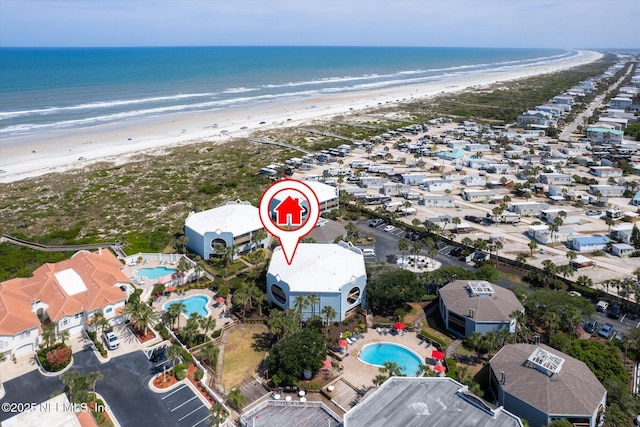 bird's eye view with a beach view and a water view