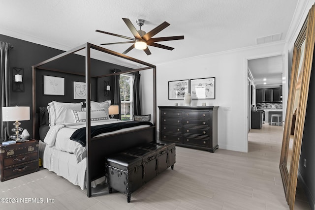 bedroom with a ceiling fan, crown molding, a textured ceiling, and visible vents