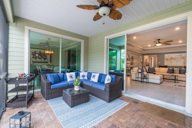 view of patio featuring a ceiling fan and an outdoor living space