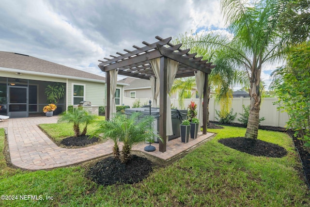 view of yard featuring fence, a pergola, a hot tub, and a patio