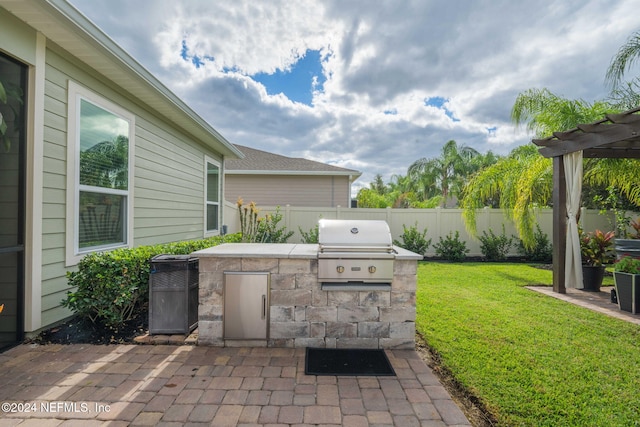 view of patio / terrace featuring grilling area, a fenced backyard, and area for grilling