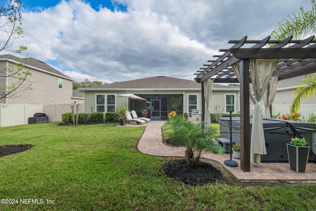 rear view of house with a fenced backyard, a pergola, a lawn, a hot tub, and a patio