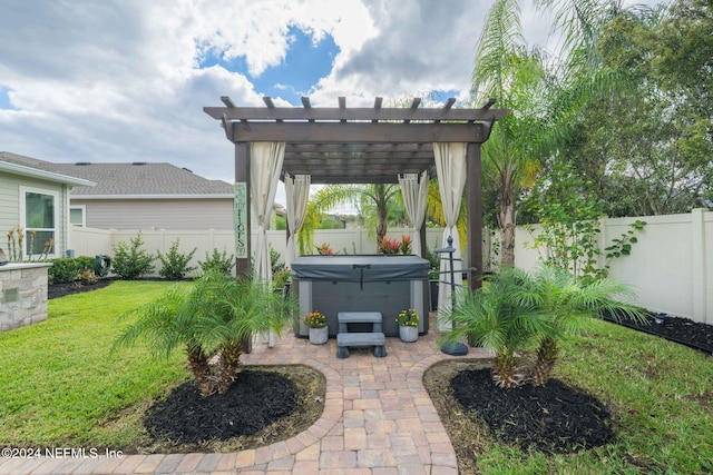 view of yard with a pergola, a patio area, a hot tub, and a fenced backyard