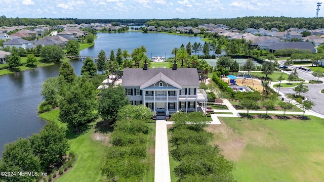 birds eye view of property featuring a residential view and a water view
