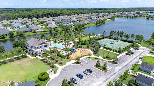 bird's eye view with a water view and a residential view