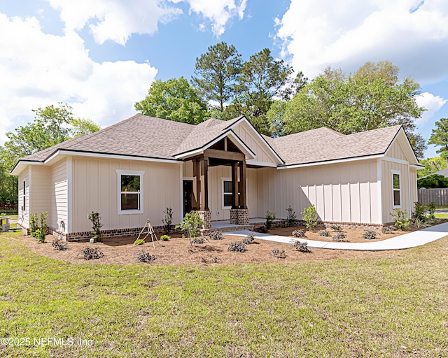 6388 Miltondale Rd, Macclenny, FL 32063 - ranch-style house featuring board and batten siding, a shingled roof, and a front yard