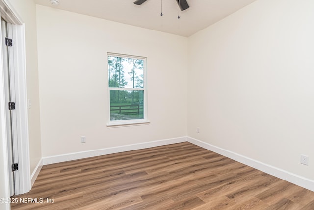 6388 Miltondale Rd, Macclenny, FL 32063 - unfurnished room with wood finished floors, a ceiling fan, and baseboards