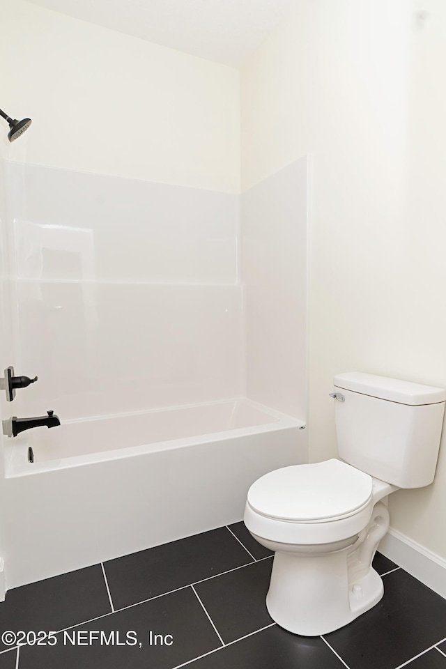 6388 Miltondale Rd, Macclenny, FL 32063 - full bath featuring toilet, washtub / shower combination, tile patterned floors, and baseboards