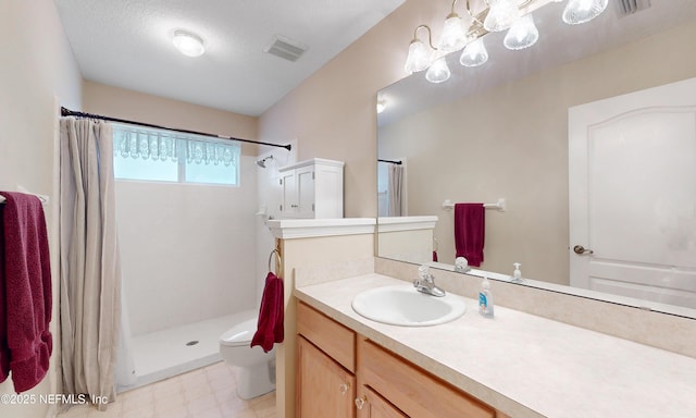 full bath featuring visible vents, vanity, tile patterned floors, toilet, and tiled shower