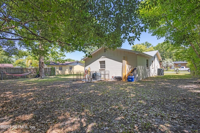 4532 Jade Dr E, Jacksonville, FL 32210 - rear view of property with fence and cooling unit