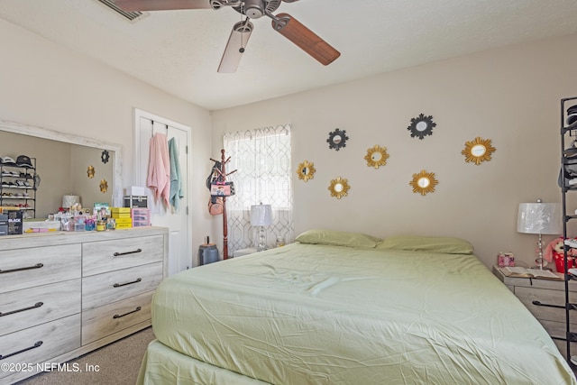 4532 Jade Dr E, Jacksonville, FL 32210 - carpeted bedroom with a ceiling fan