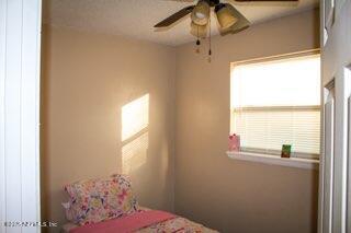 8855 Yeoman Dr, Jacksonville, FL 32208 - bedroom with a ceiling fan