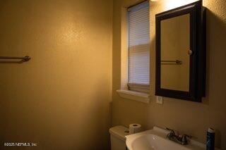 8855 Yeoman Dr, Jacksonville, FL 32208 - half bath with toilet and a sink