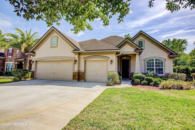 1911 Salt Creek Dr, Fleming Island, FL 32003 - view of front of home featuring concrete driveway, a front lawn, a shingled roof, a garage, and stucco siding