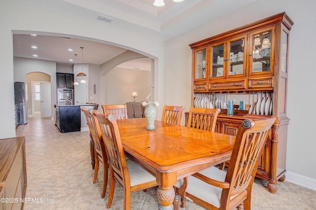 1911 Salt Creek Dr, Fleming Island, FL 32003 - dining area with recessed lighting, visible vents, light tile patterned floors, arched walkways, and baseboards