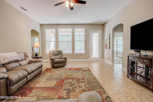 1911 Salt Creek Dr, Fleming Island, FL 32003 - living room with plenty of natural light, a ceiling fan, visible vents, and arched walkways
