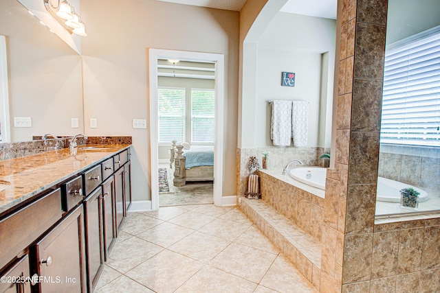 1911 Salt Creek Dr, Fleming Island, FL 32003 - full bath with tile patterned floors, vanity, ensuite bath, baseboards, and a garden tub