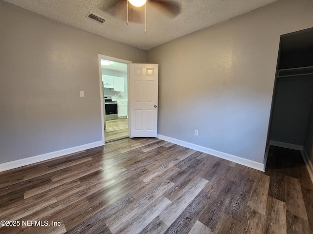 860 Westbrook Rd, Jacksonville, FL 32209 - unfurnished bedroom with visible vents, baseboards, and dark wood-style floors