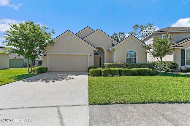 13644 Goodson Pl, Jacksonville, FL 32226 - ranch-style home featuring a garage, a front lawn, driveway, and stucco siding