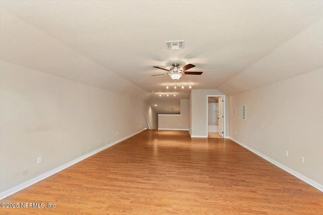 13644 Goodson Pl, Jacksonville, FL 32226 - interior space with lofted ceiling, visible vents, a ceiling fan, light wood-type flooring, and baseboards