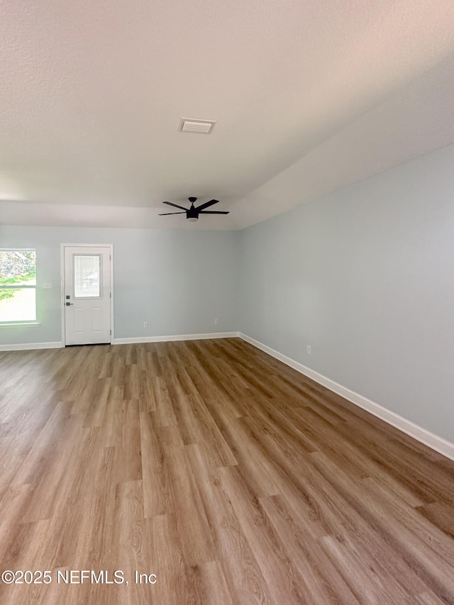 112 Moseley Ave, Palatka, FL 32177 - unfurnished living room with light wood-type flooring, ceiling fan, and baseboards